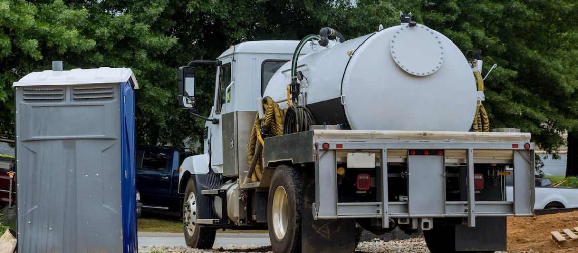 A septic truck is being used to clean portable restrooms